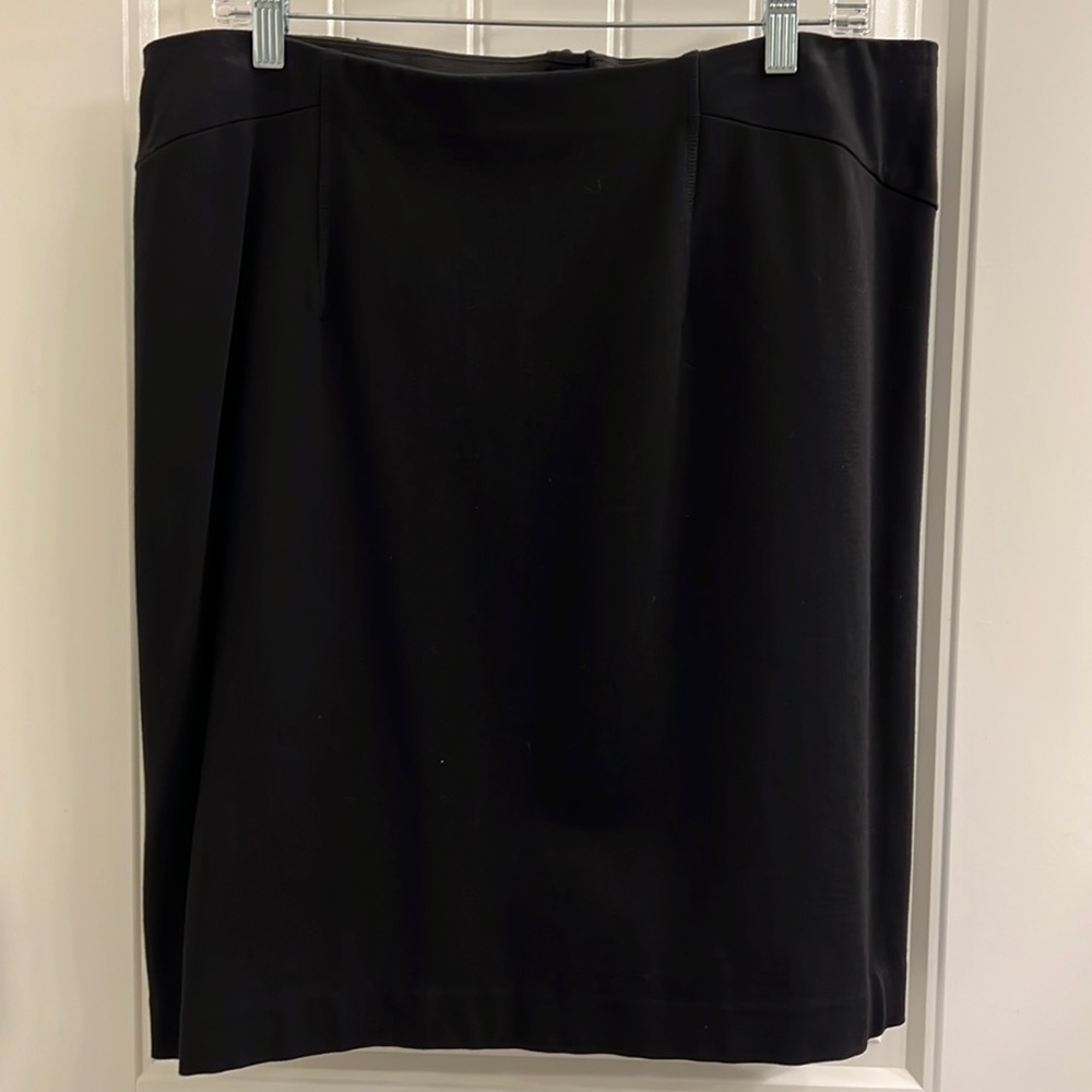 Ann Taylor Black Skirt in size 14 w/ elastic waist and zipper back.  Worn once.